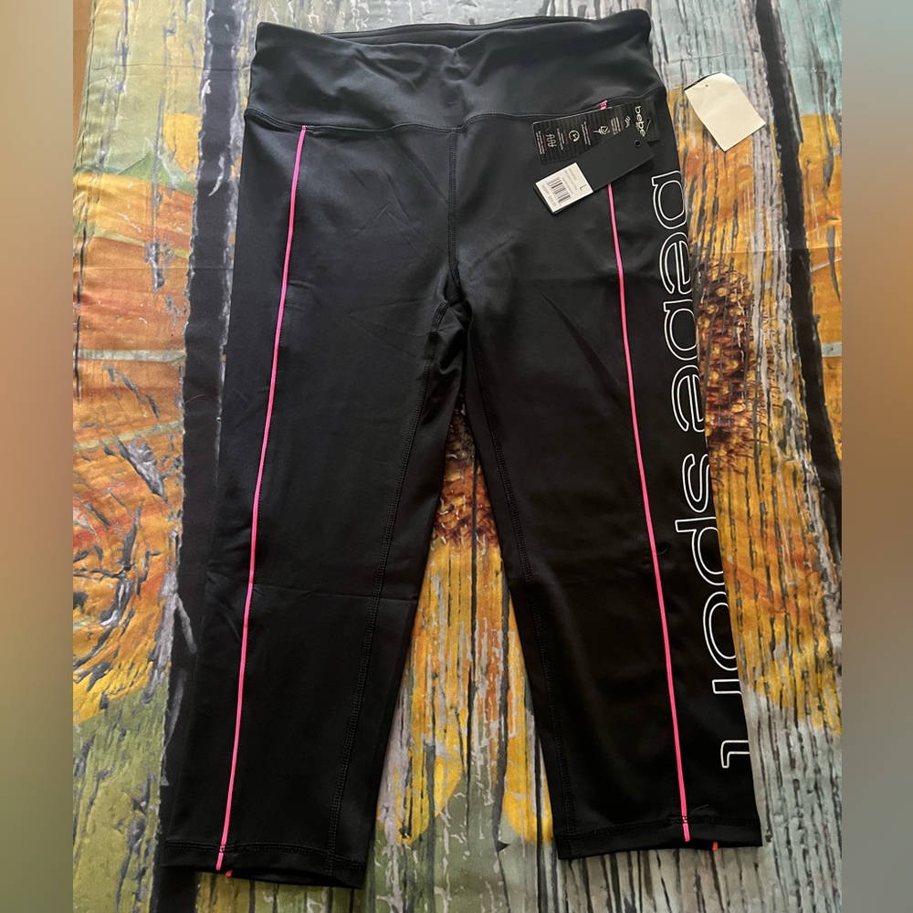 Bebe Sport Black Capris with Hot Pink Details